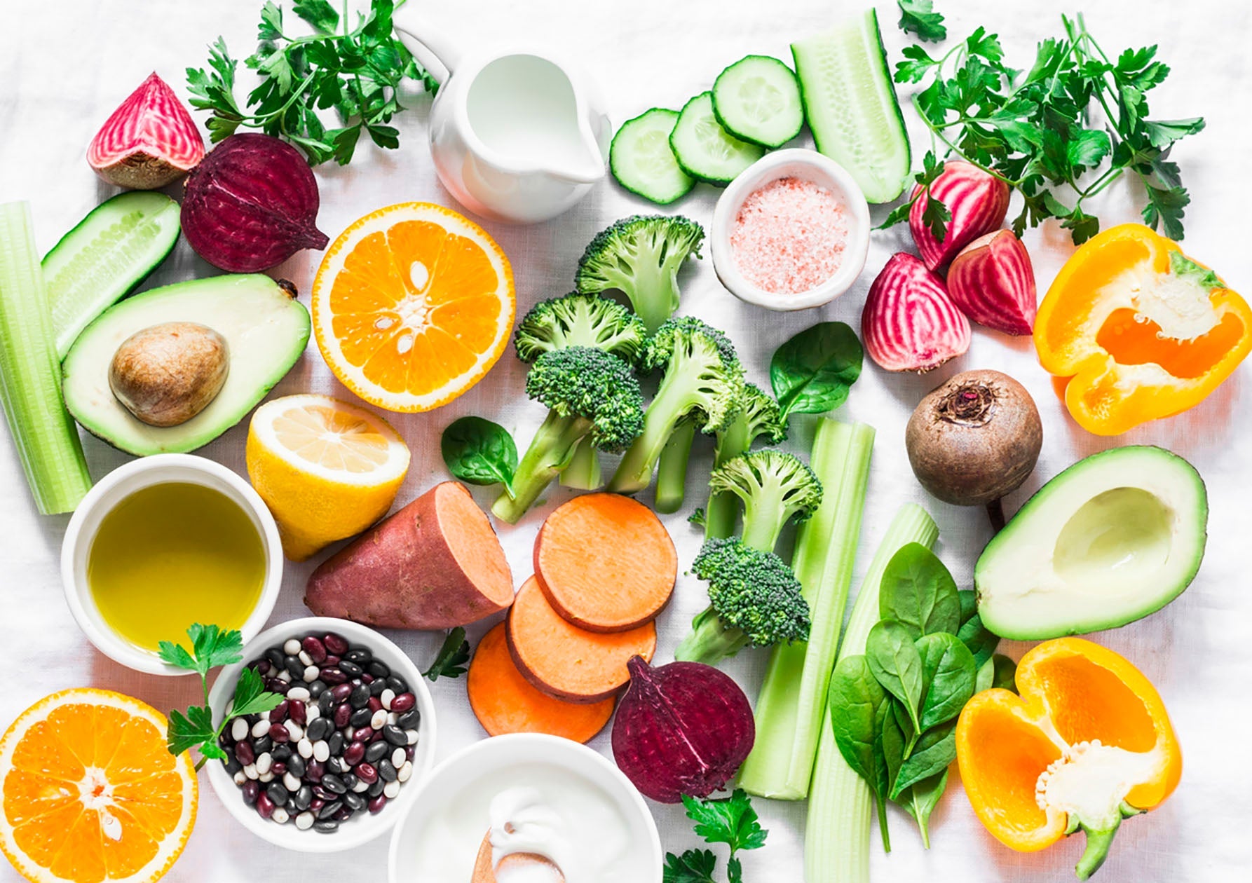 Assortment of fresh fruits, vegetables, and nuts promoting skin health through diet at Natural Beauty Spa.